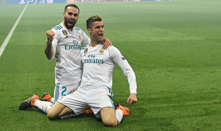 epa06585638 Real Madrid&#039;s Cristiano Ronaldo (R) celebrates scoring with Real Madrid&#039;s Dani Carvajal during the UEFA Champions League round of 16 second leg soccer match between Paris Saint G ...