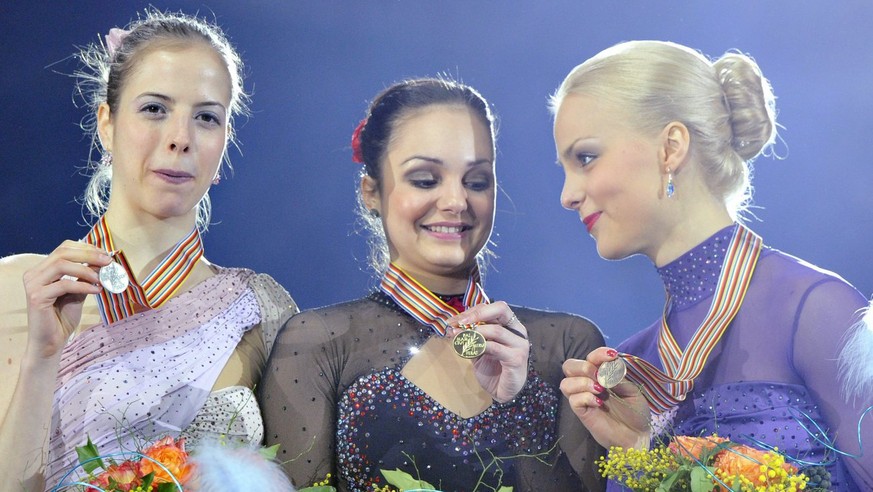 Sarah Meier from Switzerland, center, celebrates as the winner and European Champion next to silver medalist Carolina Kostner from Italy, left, and bronze medalist Kiira Korpi from Finland on the podi ...