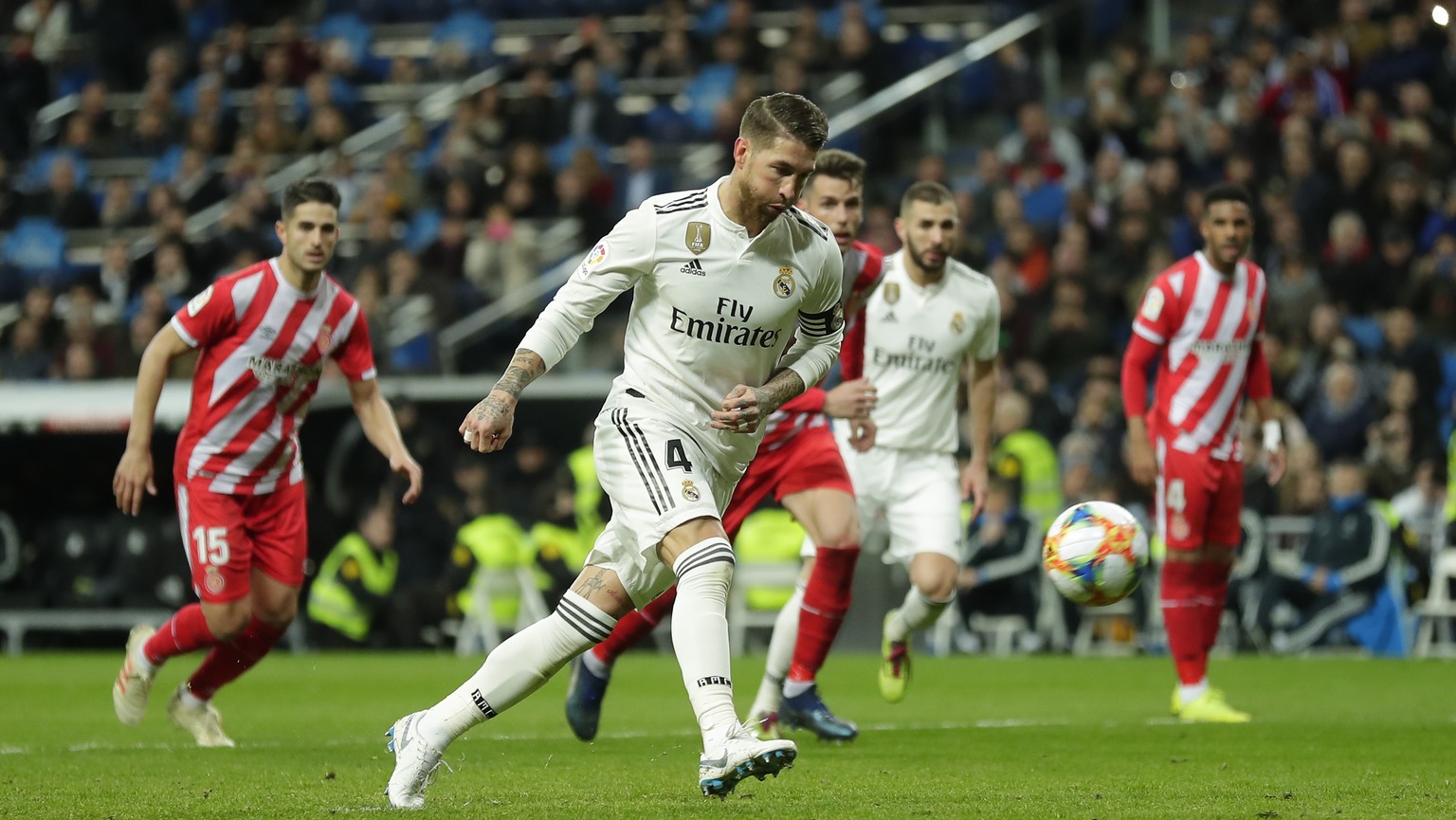 Real Madrid&#039;s Sergio Ramos kicks the ball to score a penalty during a Spanish Copa del Rey soccer match between Real Madrid and Girona at the Bernabeu stadium in Madrid, Spain, Thursday, Jan. 24, ...