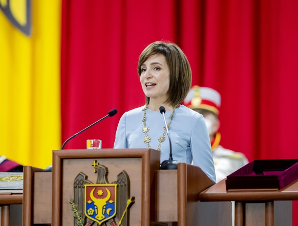 epa08902448 Moldova&#039;s new President Maia Sandu delivers her speech on stage during her inauguration ceremony at the Republican Palace i?n Chisinau, Moldova, 24 December 2020. The former prime min ...