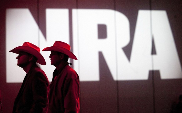 FILE - In this May 4, 2013, file photo, National Rifle Association members listen to speakers during the NRA&#039;s Annual Meetings and Exhibits at the George R. Brown Convention Center in Houston. Th ...