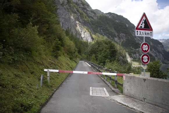 View of a road block on the Gigerwald reservoir dam, pictured on Thursday, August 13, 2020, in Vaettis, Switzerland. The road is blocked due to a ongoing search-and-rescue mission after a canyoning ac ...