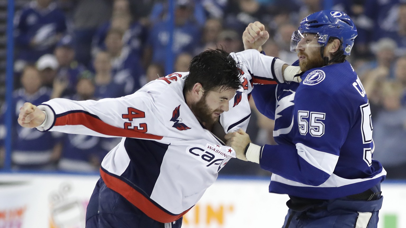 Tampa Bay Lightning defenseman Braydon Coburn (55) and Washington Capitals right wing Tom Wilson (43) fight during the first period of Game 7 of the NHL hockey playoffs Eastern Conference finals Wedne ...