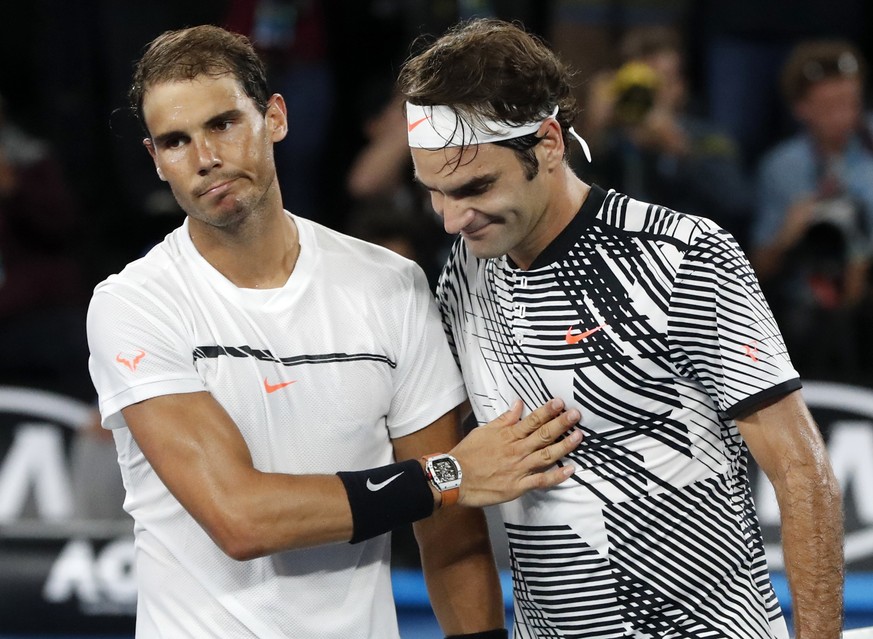 Switzerland&#039;s Roger Federer, right, is congratulated by Spain&#039;s Rafael Nadal, after Federer won the men&#039;s singles final at the Australian Open tennis championships in Melbourne, Austral ...