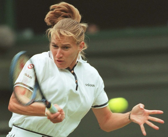 Defending champion Steffi Graf of Germany, plays a return to Nicole Arendt, from the U.S. during their third round match on Wimbledon&#039;s Centre Court, Saturday June 29 1996. Graf won the match 6-2 ...