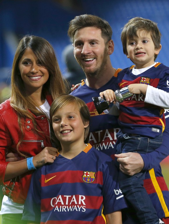 FILE - This is a Sunday, May 22, 2016 file photo of Barcelona&#039;s Lionel Messi, carrying his son, poses for a photo with his girlfriend Antonella Roccuzzo as they celebrate after winning the final  ...