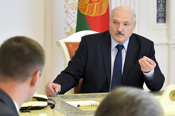 Belarusian President Alexander Lukashenko speaks at a meeting on issues of functioning and increasing the efficiency of the construction industry in Minsk, Belarus, Friday, Aug. 14, 2020. In five days ...