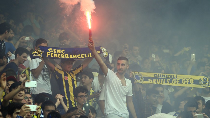 Fenerbahce fans celebrate as Robin Van Persie, of Netherlands, is presented at the team&#039;s Sukru Saracoglu Stadium in Istanbul, Tuesday, July 14, 2015. The 31-year-old former Arsenal, Feyenoord an ...