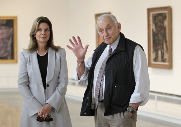 In this Sept. 19, 2014 file photo, retail mogul Leslie Wexner, right, and his wife Abigail tour the &quot;Transfigurations&quot; exhibit at the Wexner Center for the Arts in Columbus, Ohio. The retail ...