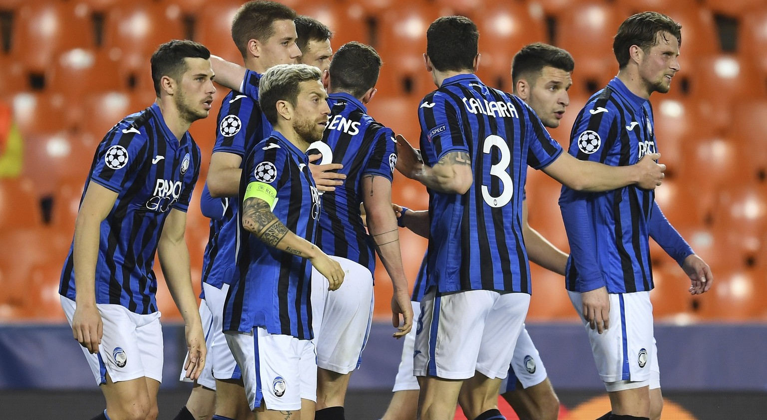 Atalanta&#039;s Josip Ilicic celebrates with teammates after scoring a penalty kick his side&#039;s second goal during the Champions League round of 16 second leg soccer match between Valencia and Ata ...