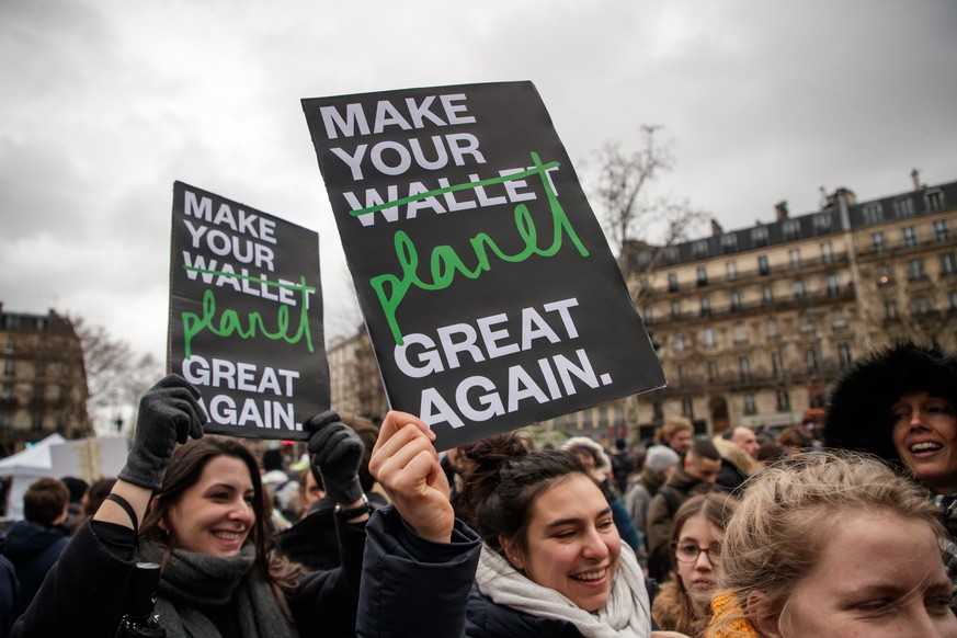 epa07325176 Environmental activists hold posters reading &#039;Make Your Planet Great Again&#039; in Republique Square during the &#039;Agora for the climate&#039; protest in Paris, France, 27 January ...