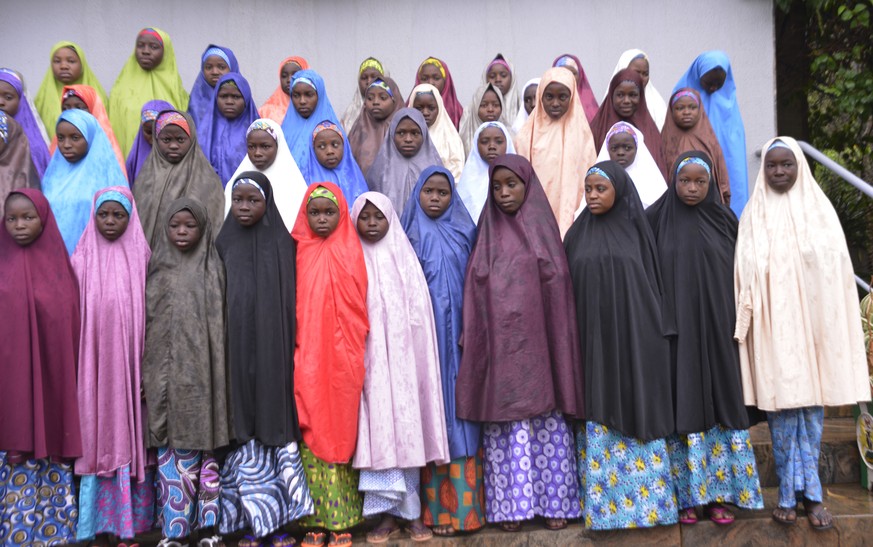 Recently freed School girls from the Government Girls Science and Technical College Dapchi, pose for a photograph after a meeting with Nigeria President, Muhammadu Buhari, at the Presidential palace i ...