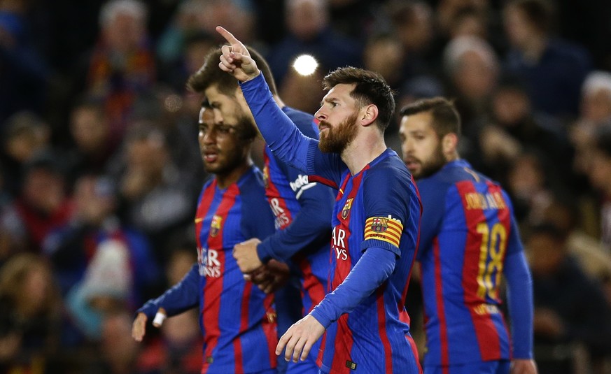 FC Barcelona&#039;s Lionel Messi gestures after scoring during the Spanish La Liga soccer match between FC Barcelona and Celta Vigo at the Camp Nou in Barcelona, Spain, Saturday, March 4, 2017. (AP Ph ...
