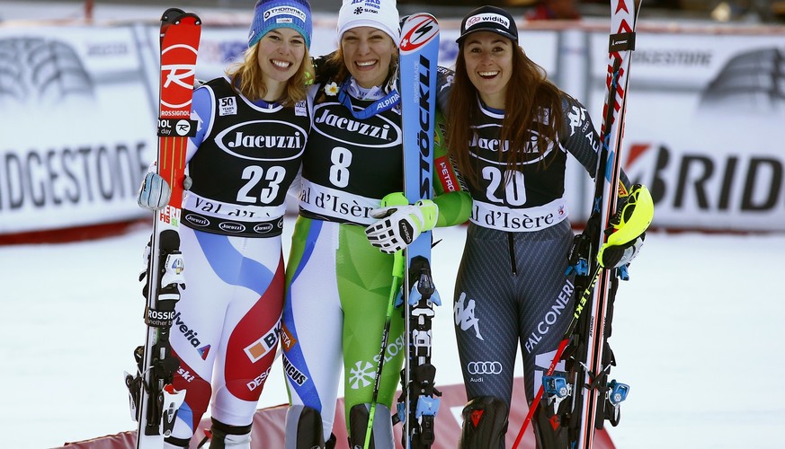 From left, Switzerland&#039;s Michelle Gisin, Slovenia&#039;s Ilka Stuhec and Italy&#039;s Sofia Goggia pose after completing an alpine ski, women&#039;s World Cup combined, in Val d&#039;Isere, Franc ...