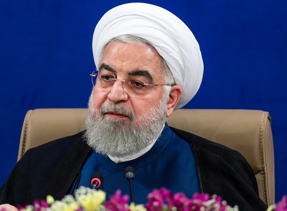 HANDOUT - Hassan Ruhani, Präsident des Iran, leitet eine Kabinettssitzung. Foto: -/Iranian Presidency/dpa - ATTENTION: editorial use only and only if the credit mentioned above is referenced in full