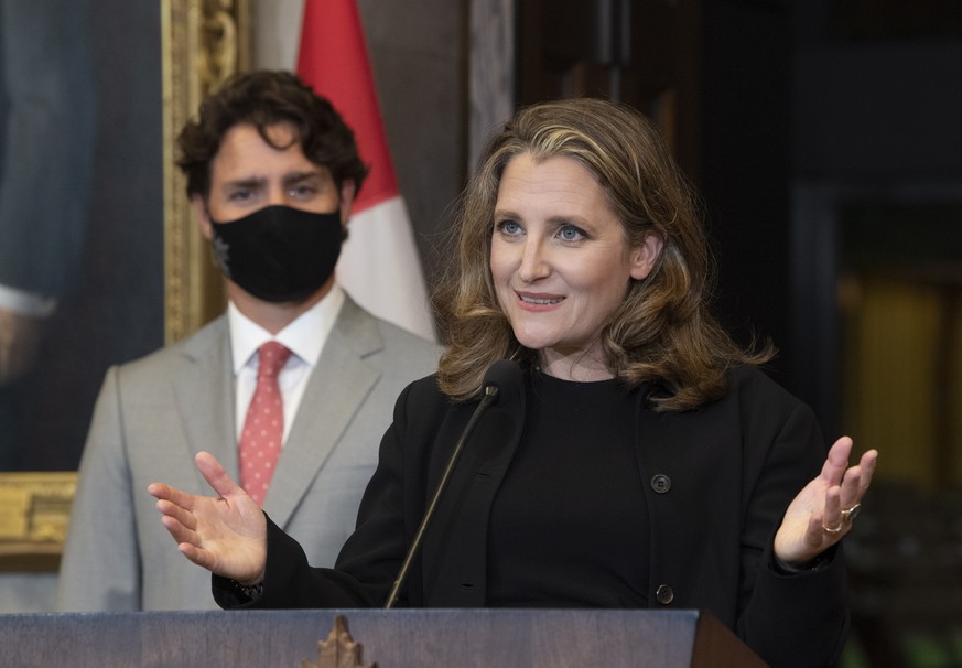 Canada Prime Minister Justin Trudeau, left, looks on as Deputy Prime Minister and Finance Minister Chrystia Freeland responds to a question during a news conference on Parliament Hill in Ottawa, Tuesd ...