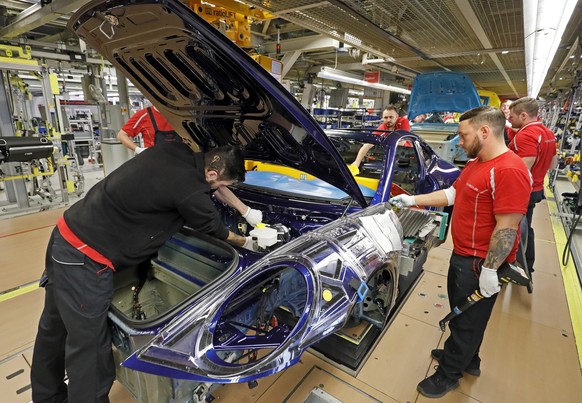 epa07478088 (FILE) - A view of the production of different sports cars at an assembly line at the German car manufacturer Porsche in Stuttgart, Germany, 19 February 2019 (reissued 01 April 2019). Repo ...