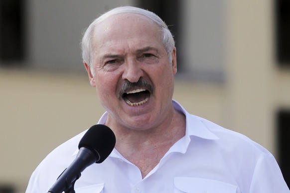 Belarusian President Alexander Lukashenko addresses his supporters gathered at Independent Square of Minsk, Belarus, Sunday, Aug. 16, 2020. Thousands of people have gathered in a square near Belarus&# ...