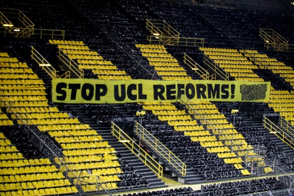 epa09064254 A banner reading &quot;Stop UCL reforms!&quot; is seen in the empty stands prior to the UEFA Champions League round of 16 second leg soccer match between Borussia Dortmund and Sevilla FC i ...