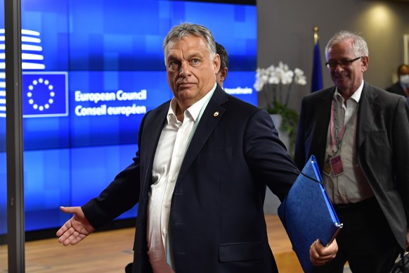 Hungary&#039;s Prime Minister Viktor Orban leaves the building after an EU summit in Brussels, Saturday, July 18, 2020. Leaders from 27 European Union nations met face-to-face for a second day of an E ...