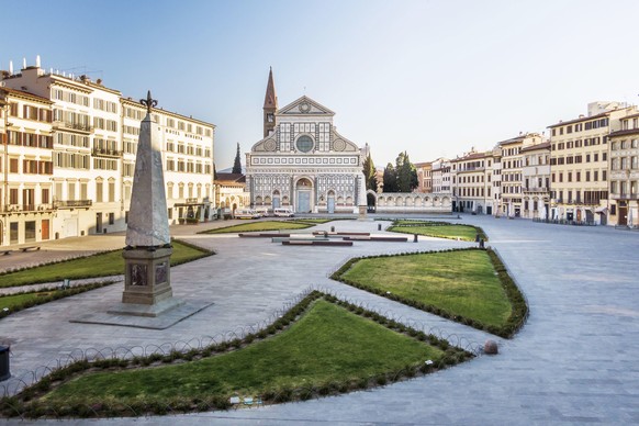 epa08358307 View of the square and church of Santa Maria Novella in Florence during lockdown emergency period aimed at stopping the spread of the Covid-19 coronavirus. Although the lockdown and full a ...