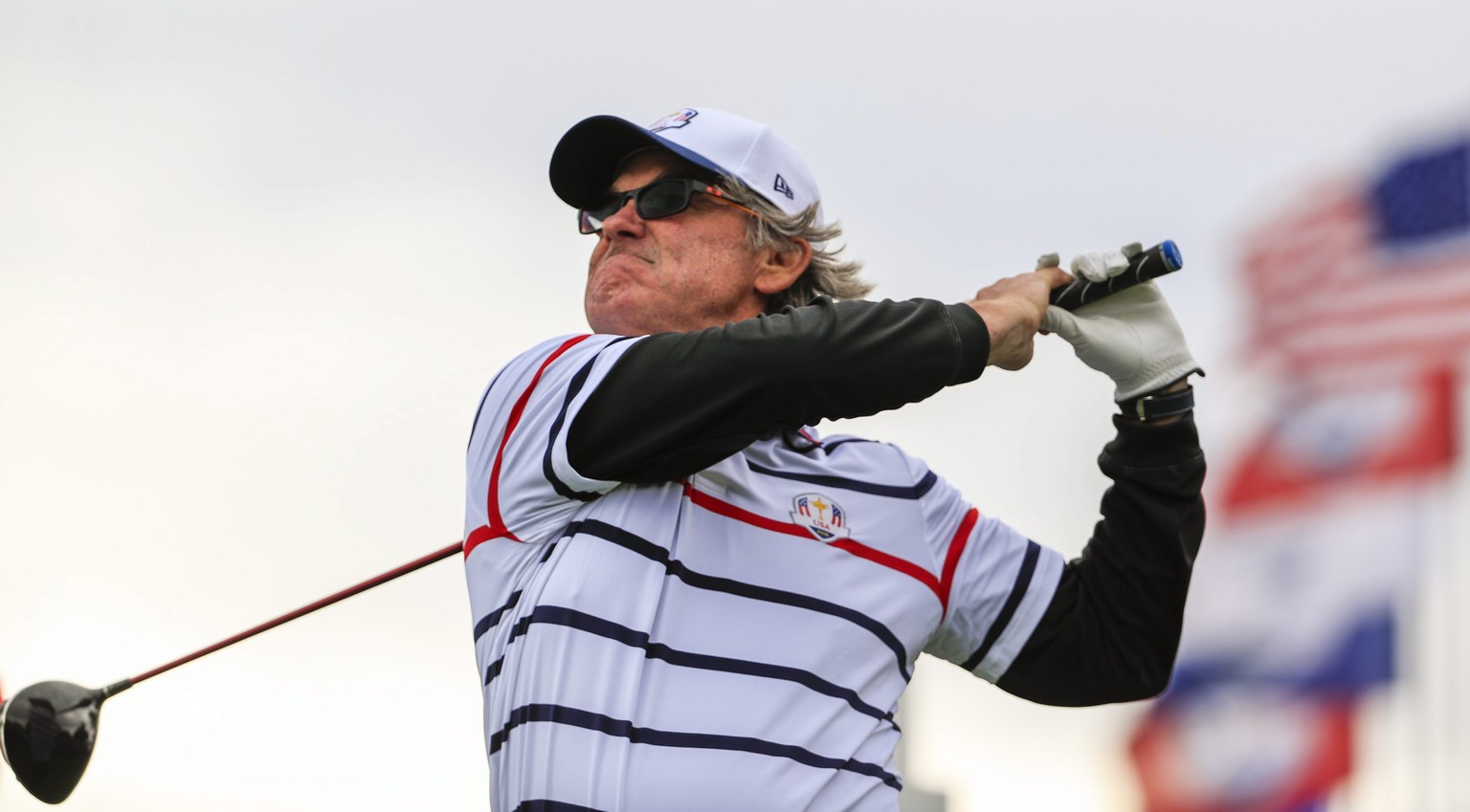epa05559312 US actor Kurt Russell hits a tee shot on the second hole during the celebrity matches for the Ryder Cup 2016 at the Hazeltine National Golf Club in Chaska, Minnesota, USA, 27 September 201 ...