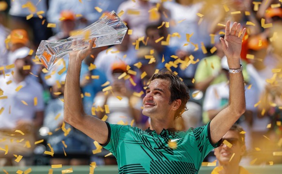 epa05885057 Roger Federer of Switzerland holds the winner&#039;s trophy after defeating Rafael Nadal of Spain in the men&#039;s singles final match at the Miami Open tennis tournament on Key Biscayne, ...