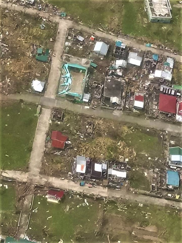 In this photo provided by the Philippine Coast Guard, damaged homes are seen at Catanduanes province, eastern Philippines in this aerial photo on Monday Nov. 2, 2020. At least 16 people were killed as ...