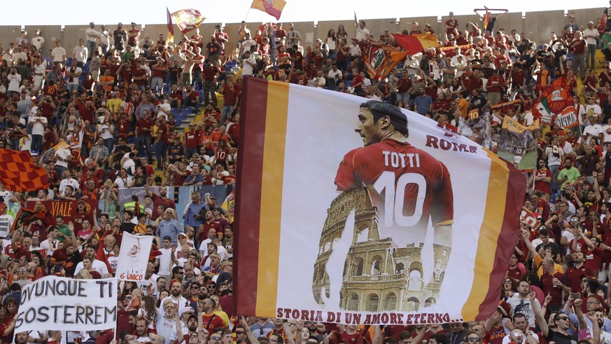 Roma fans show flags and banner for captain Francesco Totti prior to an Italian Serie A soccer match between Roma and Genoa at the Olympic stadium in Rome, Sunday, May 28, 2017. Francesco Totti is pla ...