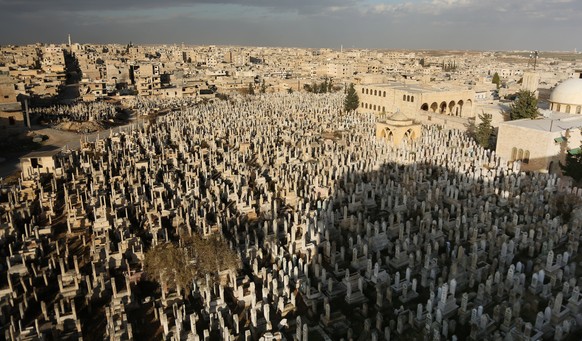 epa08100403 A view of a sprawling cemetery in Maarat al-Numan, some 31 km south of Idlib, Northern Syria, 24 December 2019 (issued 03 January 2020). According to various media reports, some 30,000 peo ...