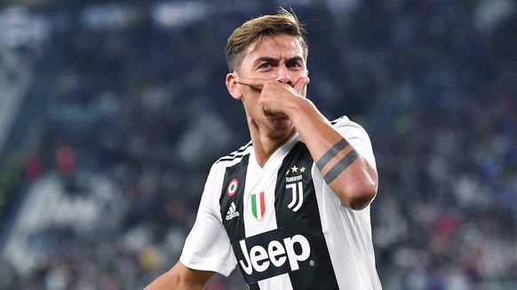 Juventus&#039; Paulo Dybala celebrates after scoring during a Serie A soccer match between Juventus and Bologna at the Allianz Stadium in Turin, Italy, Wednesday, Sept. 26, 2018. (Alessandro Di Marco/ ...