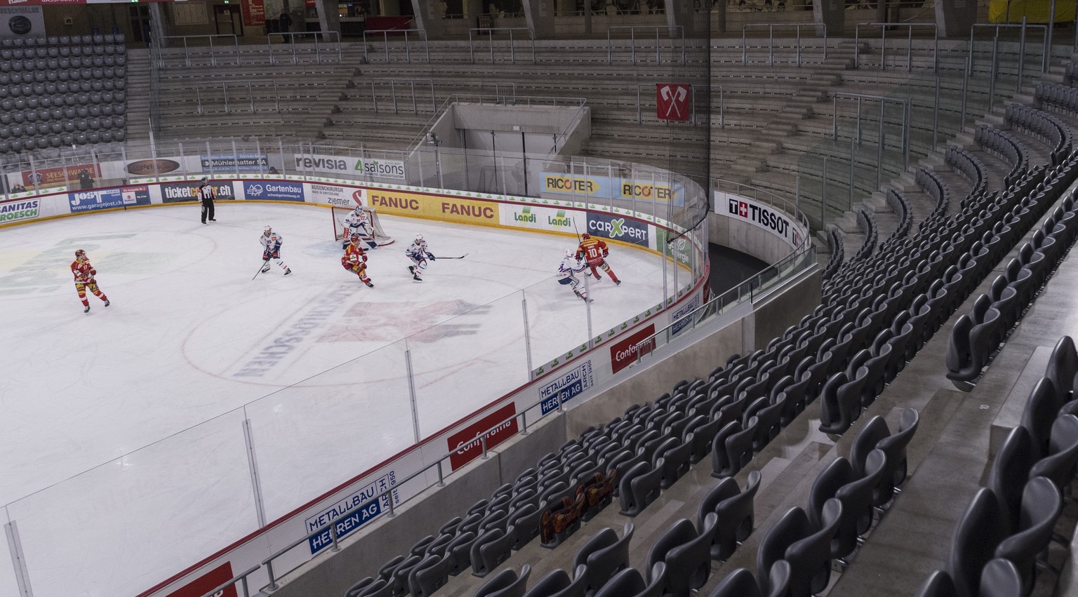 An eerie atmosphere in the almost empty stadium during the Swiss National League ice hockey match between EHC Bieland ZSC Lions, Friday, February 28, 2020 in the Tissot Arena in Biel, Switzerland. As  ...
