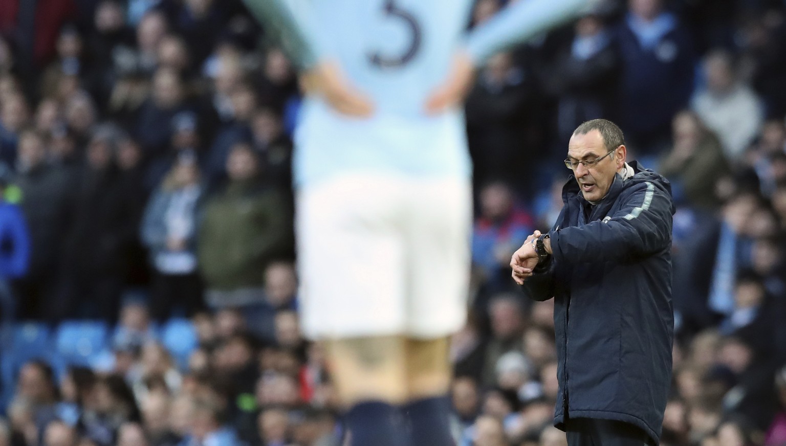 Chelsea manager Maurizio Sarri, right, reacts during the English Premier League soccer match between Manchester City and Chelsea at Etihad stadium in Manchester, England, Sunday, Feb. 10, 2019. (AP Ph ...