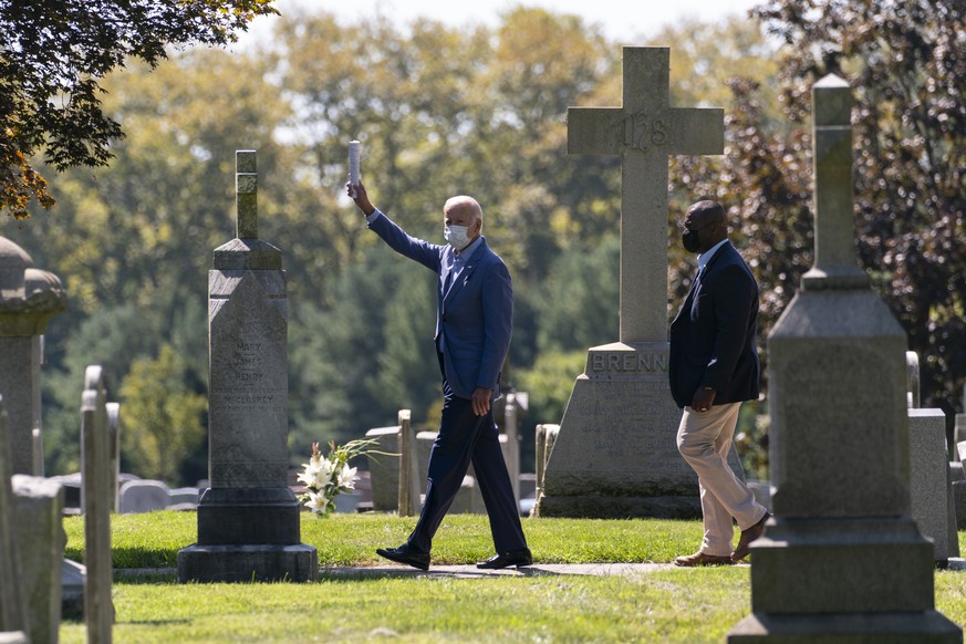 Democratic presidential candidate former Vice President Joe Biden waves to media as he leaves St. Joseph On the Brandywine Catholic Church after attending Mass in Wilmington, Del., Sunday Sept. 6, 202 ...