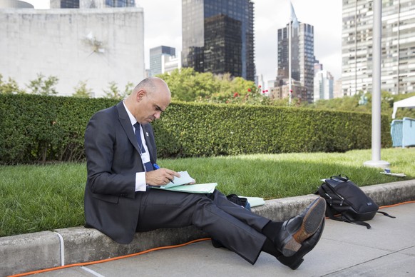 Swiss Federal President Alain Berset makes notes during a short break between bilateral meetings, at the 73rd session of the General Assembly of the United Nations at United Nations Headquarters in Ne ...