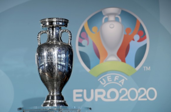 FILE - In this Thursday, Oct. 27, 2016 file photo, the Euro soccer championships trophy is seen in front of the logo during the presentation of Munich&#039;s logo as one of the host cities of the Euro ...