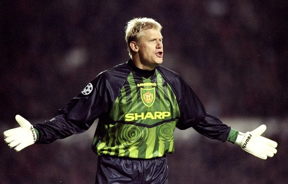 22 Oct 1997: Manchester United goalkeeper Peter Schmeichel holds out his hands during a European Champions League match against Feyenoord at Old Trafford in Manchester, England. Manchester United won  ...