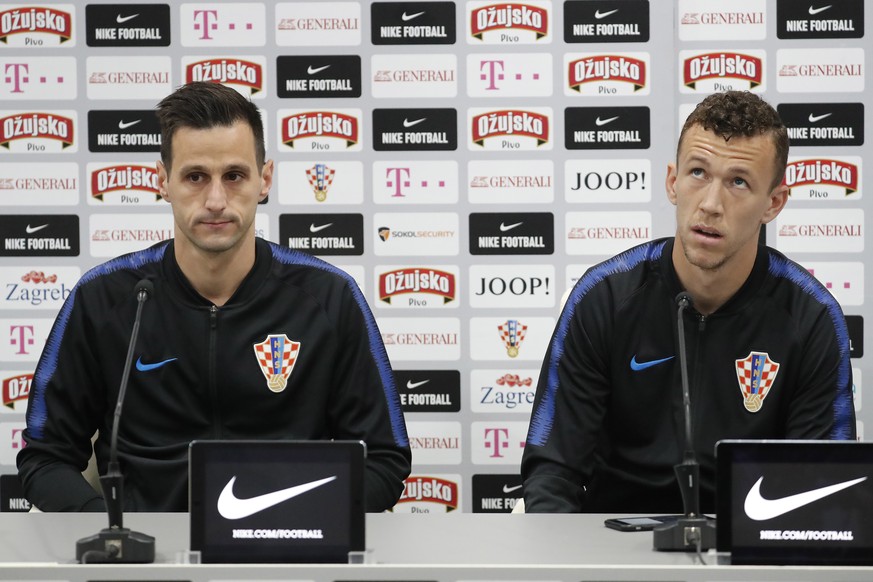 epa06805045 Croatia&#039;s Nikola Kalinic (L) and Ivan Perisic attend a press conference of the Croatian national soccer team at the Roschino Arena, outside St. Petersburg, Russia, 13 June 2018. Croat ...