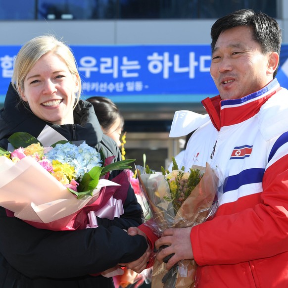 epa06472326 Sarah Murray (L), coach of the two Korea&#039;s unified women&#039;s ice hockey team, and Pak Chol-ho (R), coach of the North Korean women&#039;s ice hockey team, pose for a photo at the n ...