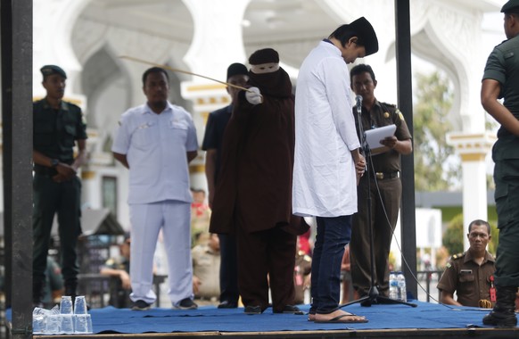 epa07412554 An Acehnese man faces a public caning punishment for having a sexual relationship without being married, in Banda Aceh, Aceh, Indonesia, 04 March 2019. Aceh is the only province in Indones ...