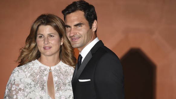 Wimbledon champion Switzerland&#039;s Roger Federer and his wife Mirka arrive at the Wimbledon Champions Dinner 2017, at the Guildhall, London, Sunday July 16, 2017. (Lauren Hurley/PA via AP)