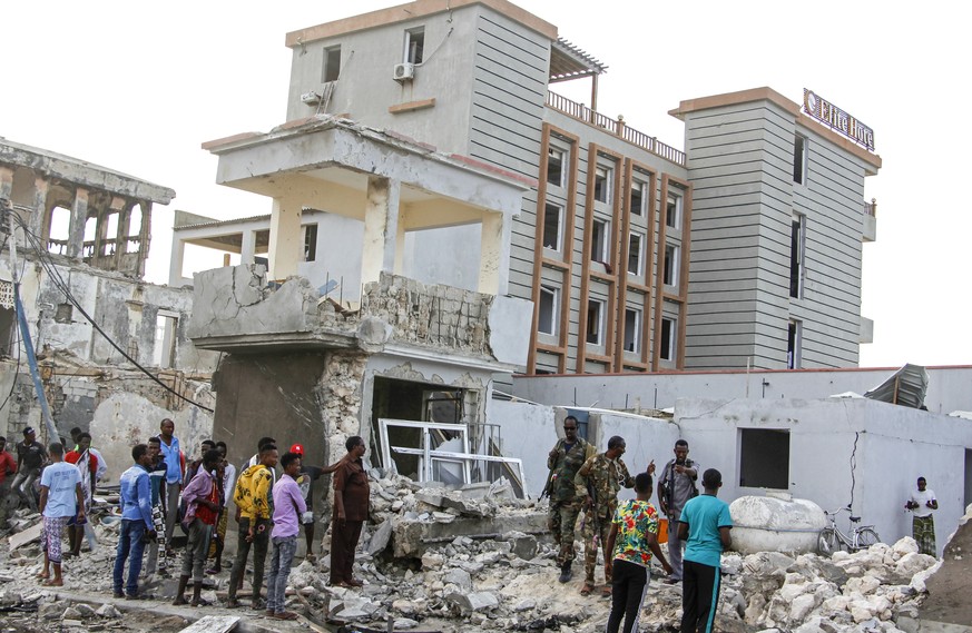 Security forces inspect a destroyed area outside the Elite Hotel in Mogadishu, Somalia Monday, Aug. 17, 2020. Somalia&#039;s security forces on Sunday ended a nearly five-hour siege by Islamic extremi ...