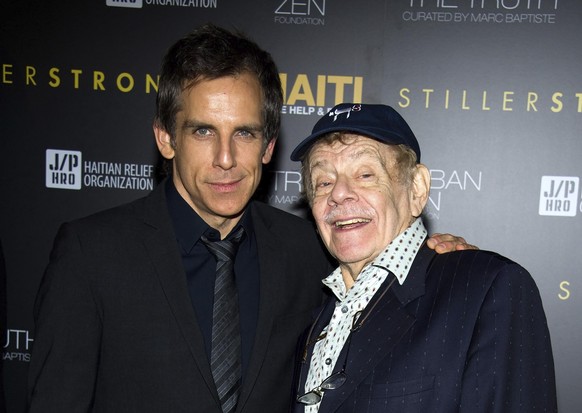 In this Feb. 11, 2011, photo, Ben Stiller, left, and his father Jerry Stiller arrive at the Help Haiti benefit honoring Sean Penn hosted by the Stiller Foundation and The J/P Haitian Relief Organizati ...