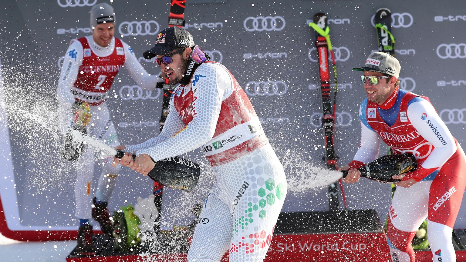 epa07251512 (L-R) Second placed Christof Innerhofer of Italy, winner Dominik Paris of Italy and third placed Beat Feuz of Switzerland celebrate on the podium after the Men&#039;s Downhill race at the  ...