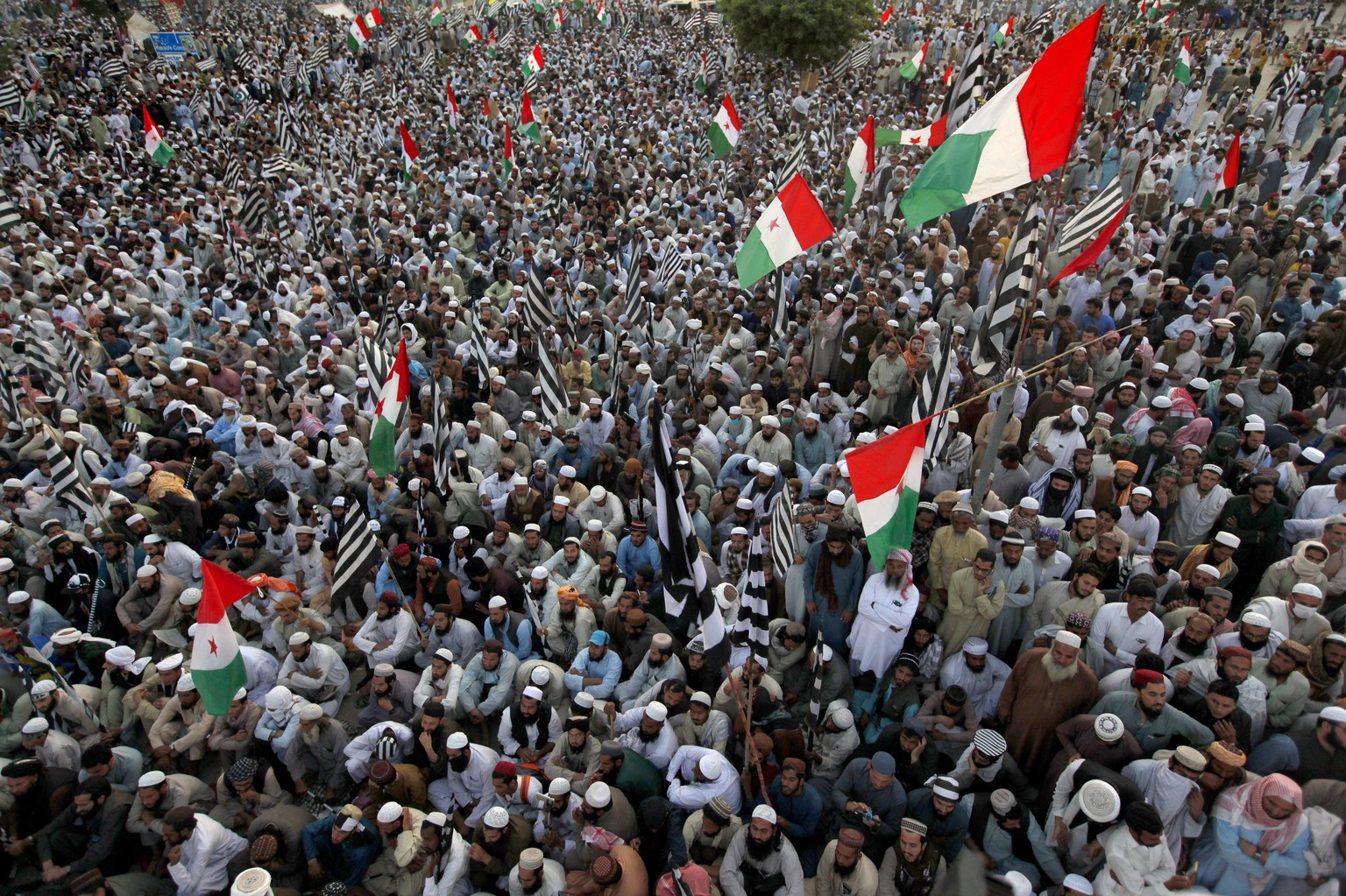 Supporters of the Jamiat Ulema-e-Islam party participate in an anti-government march, in Islamabad, Pakistan, Sunday, Nov. 3, 2019. Tens of thousands of Islamists at a massive protest camp in Pakistan ...