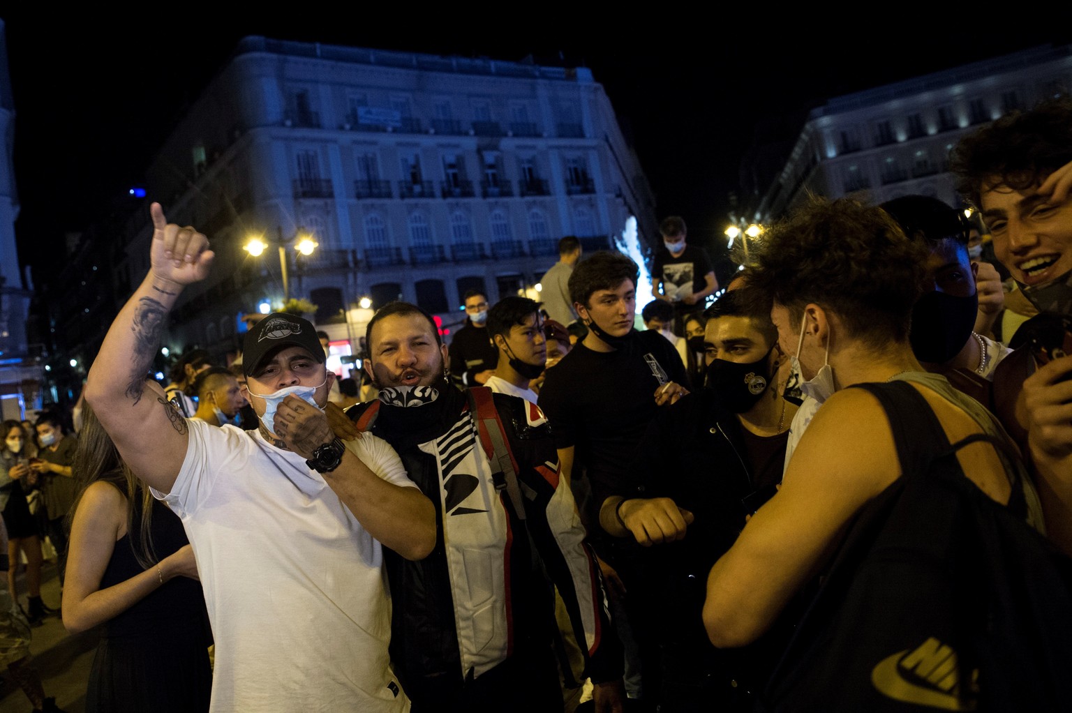 epa09186700 Hundreds of people celebrate in people celebrate in Madrid&#039;s Puerta del Sol, Spain, 08 May 2021. The state of alarm that was imposed six month ago due to the pandemic expires on 09 Ma ...