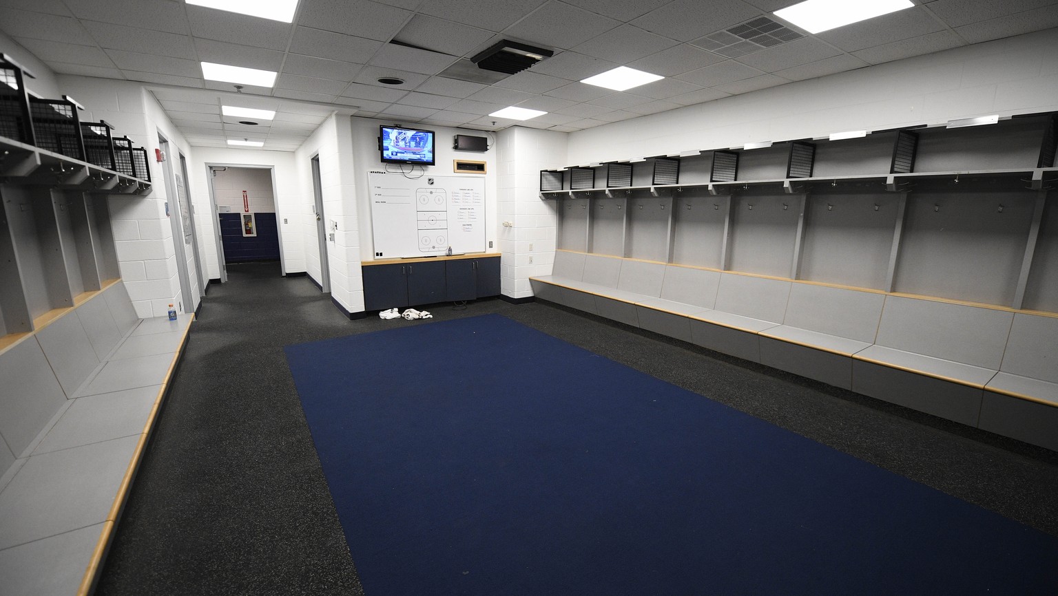 The empty visitors NHL hockey locker room is seen at Capital One Arena in Washington, Thursday, March 12, 2020. The Washington Capitals were to play the Detroit Red Wings later tonight. The NHL is fol ...