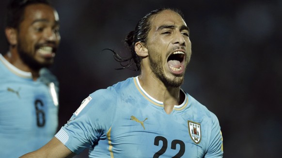 Uruguay&#039;s Martin Caceres, right, celebrates after scoring against Chile during a 2018 FIFA World Cup qualifying soccer match in Montevideo, Tuesday, Nov. 17, 2015. (AP Photo/Victor R. Caivano)