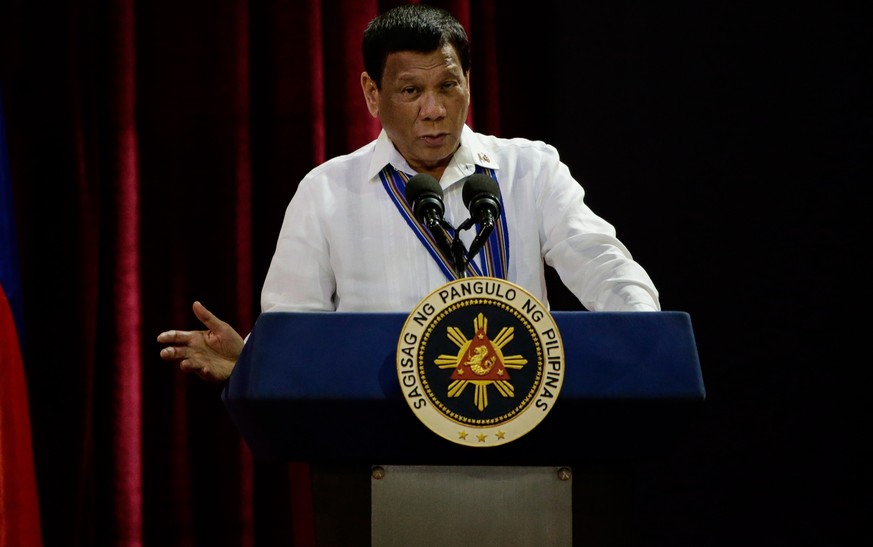 epa07243454 Philippine President Rodrigo Duterte gestures as he delivers a speech at the Philippine Air Force&#039;s change of command ceremony at the Villamor Airbase in Manila, Philippines, 21 Decem ...