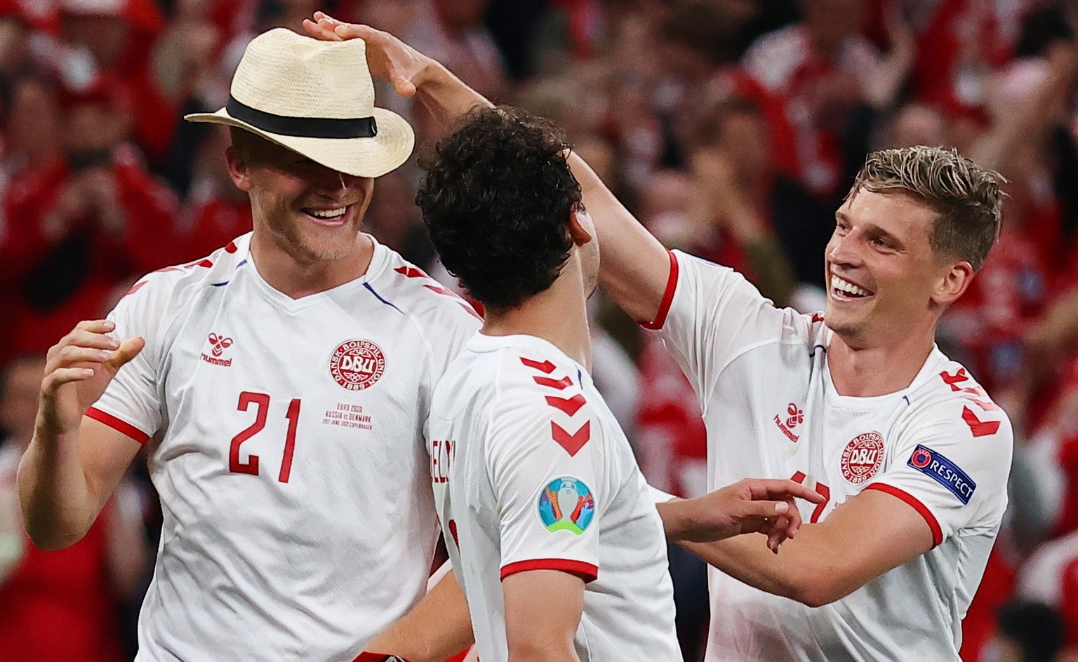 epa09292208 Players of Denmark celebrate after winning the UEFA EURO 2020 group B preliminary round soccer match between Russia and Denmark in Copenhagen, Denmark, 21 June 2021. EPA/Wolfgang Rattay /  ...
